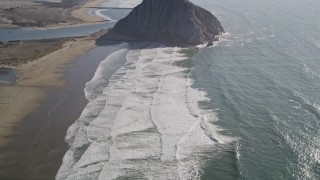 5K aerial stock footage of flying over Morro Strand Beach, revealing Morro Rock, Morro Bay, California Aerial Stock Footage | AXSF16_151