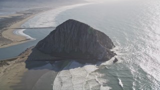 5K aerial stock footage flying by Morro Rock in Morro Bay, California Aerial Stock Footage | AXSF16_152