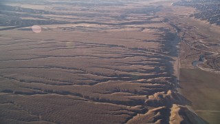 5K aerial stock footage of a view of cracks in the desert, Cuyama Valley, California Aerial Stock Footage | AXSF17_029