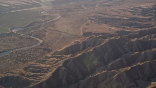 5K aerial stock footage of flying by a dry riverbed and Caliente Range mountains, Cuyama Valley, California Aerial Stock Footage | AXSF17_031