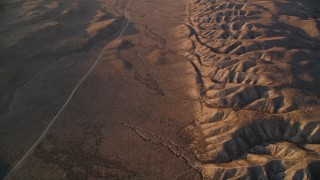 AXSF17_052 - 5K aerial stock footage reverse view of a desert road beside San Andreas Fault, San Luis Obispo County, California