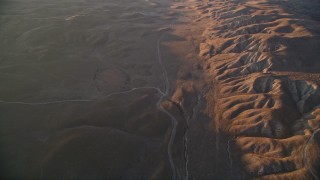 AXSF17_054 - 5K aerial stock footage of a reverse view of a road beside the San Andreas Fault, San Luis Obispo County, California