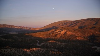 5K aerial stock footage of flying by mountains with moon above, Los Padres National Forest, California, sunset Aerial Stock Footage | AXSF17_065