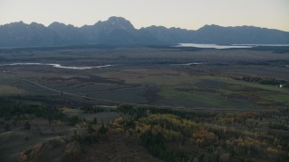 CAP_002_006 - HD stock footage aerial video of light traffic on Highway 26 through Jackson Hole, Wyoming, twilight