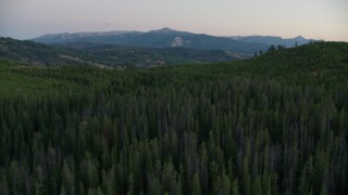 HD stock footage aerial video flyby hills and forest in Jackson Hole, Wyoming, twilight Aerial Stock Footage | CAP_002_010