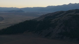 HD stock footage aerial video of flying over Blacktail Butte, Jackson Hole, Wyoming, twilight Aerial Stock Footage | CAP_002_018