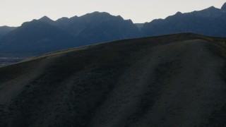 HD stock footage aerial video of Blacktail Butte and mountains in Jackson Hole, Wyoming, twilight Aerial Stock Footage | CAP_002_021