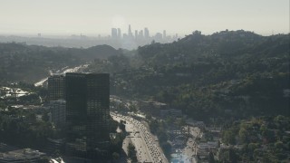 HD stock footage aerial video fly over office building to approach the skyline of Downtown Los Angeles, California Aerial Stock Footage | CAP_004_005