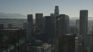 HD stock footage aerial video passing tall skyscrapers in Downtown Los Angeles, California Aerial Stock Footage | CAP_004_016