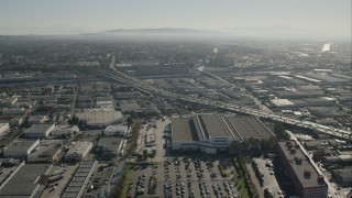 HD stock footage aerial video approach office building beside freeway in Boyle Heights, Los Angeles, California Aerial Stock Footage | CAP_004_019