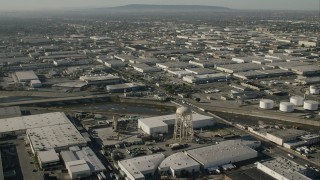 HD stock footage aerial video of warehouses and a water tower by LA River in Vernon, California Aerial Stock Footage | CAP_004_023