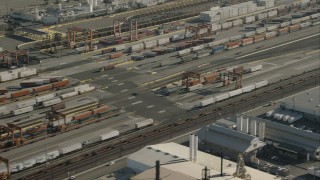 CAP_004_026 - HD stock footage aerial video of passing shipping containers at a train yard, Vernon, California