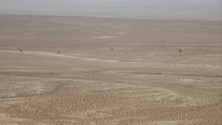 HD stock footage aerial video track four military helicopters flying over the Mojave Desert, California Aerial Stock Footage | CAP_005_001