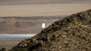 HD stock footage aerial video flyby mountain to reveal Ivanpah Solar Electric Generating System, Mojave Desert, California Aerial Stock Footage | CAP_005_004