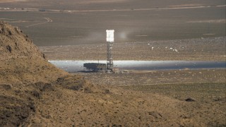 CAP_005_007 - HD stock footage aerial video of one of the towers at Ivanpah Solar Electric Generating System, Mojave Desert, California