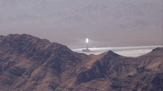 HD stock footage aerial video zoom in on one of the towers at Ivanpah Solar Electric Generating System, Mojave Desert, California Aerial Stock Footage | CAP_005_012