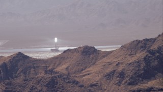 HD stock footage aerial video zoom to wider view of solar towers, Ivanpah Solar Electric Generating System, Mojave Desert, California Aerial Stock Footage | CAP_005_013