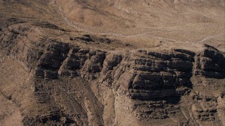 HD stock footage aerial video approach and tilt to top of desert ridge in the Mojave Desert, California Aerial Stock Footage | CAP_005_019