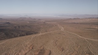 HD stock footage aerial video of flying over an arid desert valley in the Mojave Desert, California Aerial Stock Footage | CAP_005_021