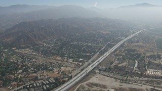 HD stock footage aerial video of suburban neighborhoods and the 210 freeway in Lake View Terrace, California Aerial Stock Footage | CAP_006_004