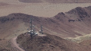 HD stock footage aerial video of radio towers on a Mojave Desert mountain in San Bernardino County, California Aerial Stock Footage | CAP_006_016