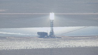 HD stock footage aerial video of glowing boiler and mirror array at the Ivanpah Solar Electric Generating System in California Aerial Stock Footage | CAP_006_029