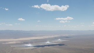 HD stock footage aerial video of clouds hovering above the Ivanpah Solar Electric Generating System in California Aerial Stock Footage | CAP_006_033