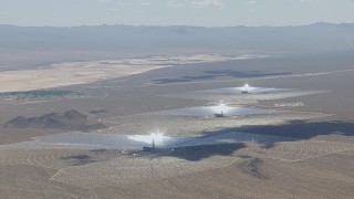 HD stock footage aerial video of a view of the Ivanpah Solar Electric Generating System in California with cloud shadow on the arrays Aerial Stock Footage | CAP_006_036