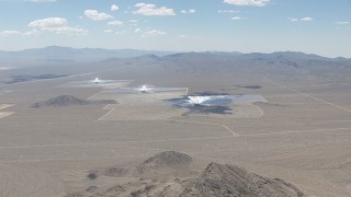 HD stock footage aerial video of a view across the desert at the Ivanpah Solar Electric Generating System in California Aerial Stock Footage | CAP_006_040