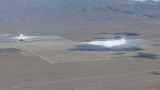 HD stock footage aerial video zoom wider from one of the three solar arrays at Ivanpah Solar Electric Generating System in California Aerial Stock Footage | CAP_006_043