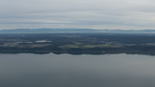 HD stock footage aerial video of Mount Rainier and golf course seen from Puget Sound in DuPont, Washington Aerial Stock Footage | CAP_009_001