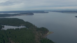 CAP_009_002 - HD stock footage aerial video fly over Anderson Island to approach Puget Sound, Washington