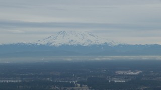 HD stock footage aerial video of a view of Mount Rainier, partially hidden by clouds, Washington Aerial Stock Footage | CAP_009_006