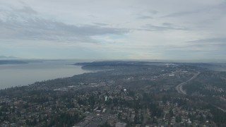 CAP_009_028 - HD stock footage aerial video flyby suburban neighborhoods and I-5 near Puget Sound in Des Moines, Washington