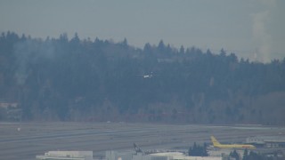 CAP_009_031 - HD stock footage aerial video track a plane coming in for a landing at Seattle Tacoma Airport, Washington