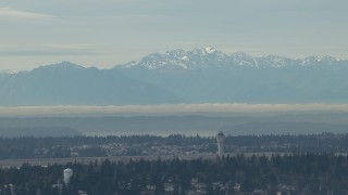 HD stock footage aerial video of the Olympic Mountains and the Seattle Tacoma Airport control tower, Washington Aerial Stock Footage | CAP_009_035