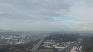 CAP_009_039 - HD stock footage aerial video of Downtown Seattle skyline seen while approaching Boeing Field, Washington