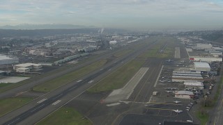 HD stock footage aerial video fly over hangars and parked planes at Boeing Field, Washington Aerial Stock Footage | CAP_009_041