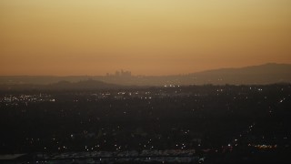 HD stock footage aerial video of the Downtown Los Angeles skyline at twilight seen from homes in the San Gabriel Valley, California Aerial Stock Footage | CAP_010_002