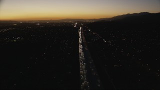 HD stock footage aerial video tilt down to heavy traffic on the I-10 freeway at sunset through the in the San Gabriel Valley, California Aerial Stock Footage | CAP_010_004