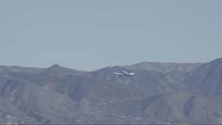 HD stock footage aerial video of a small airplane flying by the Verdugo Mountains in Burbank, California Aerial Stock Footage | CAP_012_001