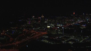 HD stock footage aerial video of passing by city buildings and skyscrapers at night, Midtown Atlanta, Georgia Aerial Stock Footage | CAP_013_021