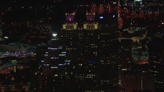 HD stock footage aerial video fly away from 191 Peachtree Tower, reveal SunTrust Plaza at night, Downtown Atlanta, Georgia Aerial Stock Footage | CAP_013_034