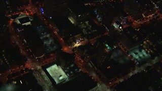 CAP_013_040 - HD stock footage aerial video reverse view of rooftop hotel pool and street at night, Midtown Atlanta, Georgia