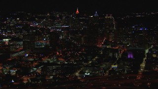 HD stock footage aerial video of flying away from the downtown skyline at nighttime, Downtown Atlanta, Georgia Aerial Stock Footage | CAP_013_046