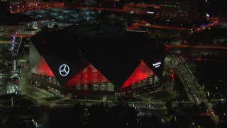 HD stock footage aerial video of a reverse view of the stadium at nighttime, Atlanta, Georgia Aerial Stock Footage | CAP_013_052