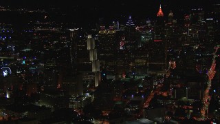 HD stock footage aerial video of a reverse view of downtown's skyscrapers and city buildings at night, Downtown Atlanta, Georgia Aerial Stock Footage | CAP_013_067