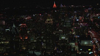 HD stock footage aerial video approach One Atlantic Center, Bank of America Plaza in background at night, Midtown Atlanta, Georgia Aerial Stock Footage | CAP_013_078