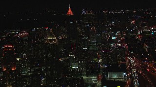 HD stock footage aerial video of a wide view of skyscrapers and city buildings at night, Downtown and Midtown Atlanta, Georgia Aerial Stock Footage | CAP_013_079