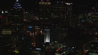 HD stock footage aerial video of skyscrapers towering over city buildings at night, Downtown Atlanta, Georgia Aerial Stock Footage | CAP_013_106